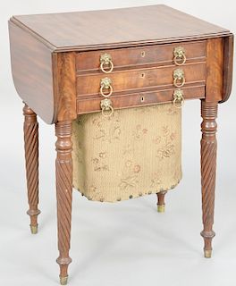 Sheraton mahogany work table, with drop leaves and three drawers including bag drawer set on twist turned legs, circa 1830. height 27 3/4 inches, top 