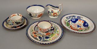 Group of ten Gaudy Dutch pieces, single rose pattern, creamer, cups, saucers, bowls and two plates. largest diameter 10 inches.
