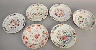 Group of six Chinese export porcelain plates, hand painted wildflowers and lotus, one repaired with old tag belonging to the wedding set of china of R