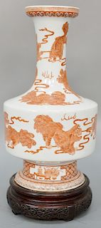 Chinese porcelain vase, having underglazed iron red painted Buddhist lion, 19th century, with Kangxi mark on bottom. height of vase 15 1/2 inches.