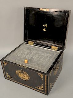 Black lacquered chinoiserie tea caddy, having bail handles opening to signed interior lid and incised pewter lining decorated with figures in courtyar