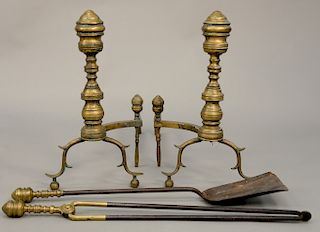 Four piece lot to include, pair of Federal brass andirons with log stops and two matching brass top tools. height 20 1/2 inches, depth 26 inches.