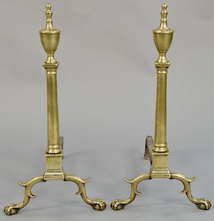 Pair of Chippendale brass andirons, with urn tops and turned shafts, set on ball and claw feet. height 25 3/8 inches.