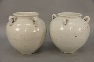 Pair of white glazed monochrome stoneware jars, China 19th century (possibly older), with four loop handles in Song style, unmarked. height 10 inches.