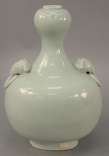 Celadon pilgrim bottle/vase, China, 19th century, with elephantine handles, the entire body and garlic shaped mouth covered evenly in a soft seafoam g