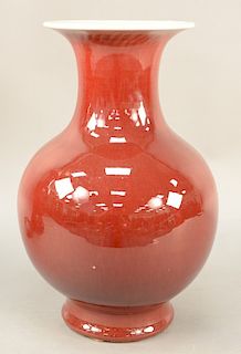 Oxblood (Langyao) bottle vase, China, 19th/20th century, with large flaring trumpet mouth, a cream interior and base glaze and slight trim/grinding to