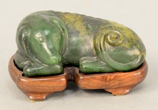 Carved Chinese green jade recumbent dog, on carved stand. length 3 inches. Provenance: Estate from Park Avenue, New York