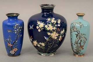 Group of three blue cloisonne enamel vases, Japan, 19th/20th century Meiji/Taisho, all with floral decoration on a dark blue ground. height 4-5.5inche