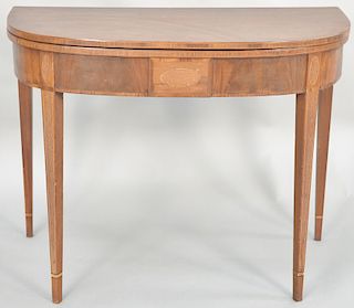 Federal mahogany game table set on square tapered legs, circa 1800. height 28 1/4 inches, width 36 inches, depth 17 1/2 inches.