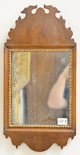 Queen Anne mahogany mirror having old glass. height 22 1/2 inches, width 11 1/4 inches.