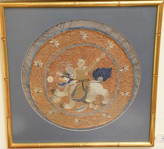 Round silk embroidered panel, figure riding foo dog, diameter 15 3/4 inches.