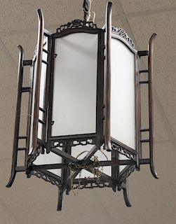 Pair of Chinese hanging lamps, having hardwood hexagon frame with frosted glass panels, height 23 inches, width 19 1/4 inches.