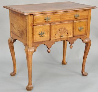 Queen Anne cherry lowboy, having rectangular top with compass star inlay over one long drawer over three short drawers, having central drawer with con