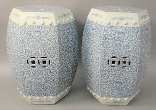 Pair of blue & white hexagonal garden seats, China, Republic Period decorated with underglaze blue flowers, scrolling foliage, double coin reticulated