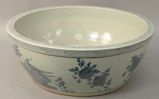 Blue & white foot basin, China, 19th/20th century, with the exterior decorated in underglaze blue birds and flowers, unglazed base, diameter: 22 inche