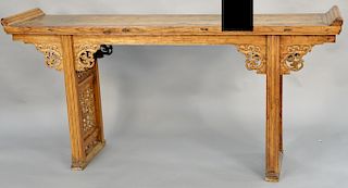 Large provincial light wood altar table, China, 19th century, with stylized, reticulated dragons on the apron and lattice-work paneled legs, height: 3