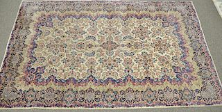 Kirman Oriental carpet, wear, 10' 9" x 17' 5".