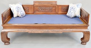 Hardwood single bed, China, 19th/20th century, the back panel with figural carving, the sides featuring European style floral swags, height: 20 inches