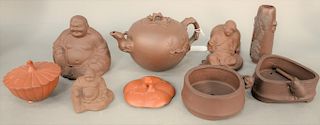 Group of Yixing earthenware articles, China, including a teapot, two Budai figures, a small vase (inscribed), small covered bowl, etc, height: 6 inche