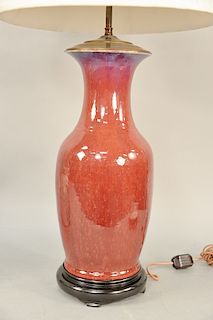Oxblood (langyao) baluster vase lamp, China 19th/20th century, with an overall even red glaze, height: 18 inches.