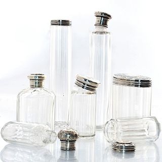 7 GLASS CONTAINERS WITH SILVER TOPS