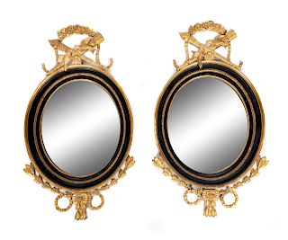 A Pair of Louis XVI Style Parcel Ebonized Giltwood Mirrors