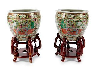A Pair of Rose Medallion Porcelain Fish Bowls with Wood Stands
Diameter 19 inches.