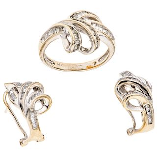 A white gold 14 K ring and pair of earrings set with simulants.