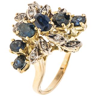 DE LA FIRMA J ROSSI a yellow gold 18 K ring with sapphires and diamonds.