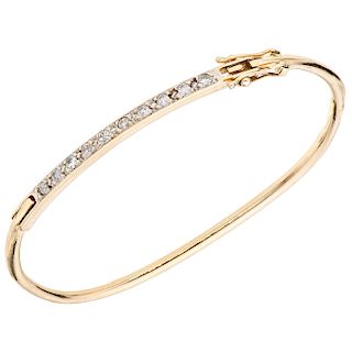 A yellow gold 14 K bracelet with diamonds.