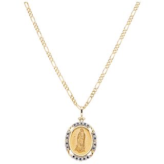 A yellow gold 14 K necklace and medal with simulants.