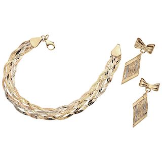 An Italian design yellow, white and pink gold 14 K bracelet and earrings set.