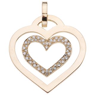 A yellow gold 14 K pendant with diamonds.