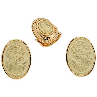 A yellow gold 14 K ring and earrings set with cameo.