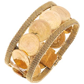A yellow gold 21. 6 K and 18 K bracelet with yellow gold coins.
