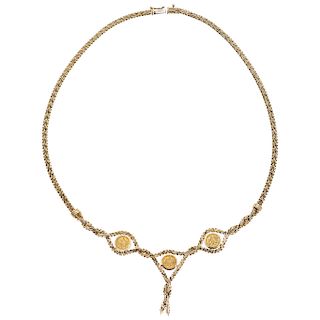 A yellow gold 14 K necklace with made according coins.