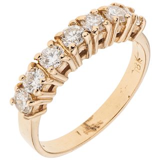 A yellow gold 18 K diamond ring.