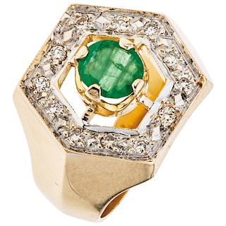 A yellow gold 14 K diamond ring with emerald.