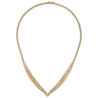 A yellow, white and pik gold 14 K necklace.