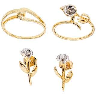 A yellow gold 14 K pair of rings and pair of earrings.