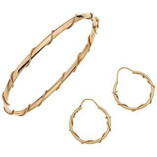 A yellow gold 14 K bracelet and hoops set.
