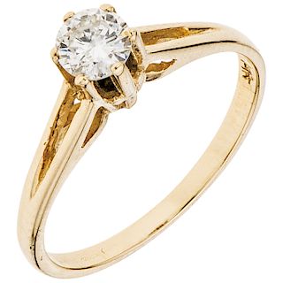 A yellow gold 14 K solitaire ring with diamond.