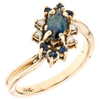 A yellow gold 14 K diamond ring with sapphires.