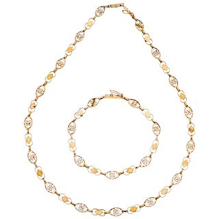 A yellow gold 14 K filigree necklace and bracelet set.