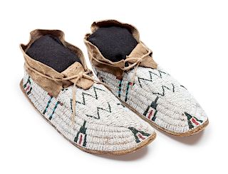 Cheyenne Beaded Hide Moccasins
length 11 inches 