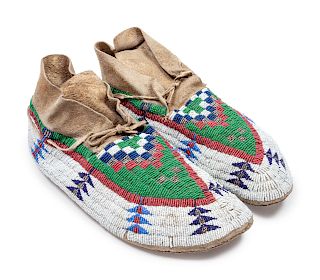 Cheyenne Beaded Hide Moccasins
length 11 inches