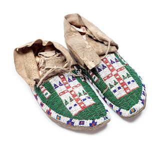 Northern Plains Beaded Buffalo Hide Moccasins
length 9 1/2 inches