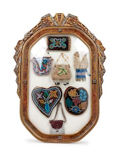 Collection of Eastern Woodlands Beaded Bags in Victorian Frame
 
size of largest 4 1/2 x 4 1/2 inches 