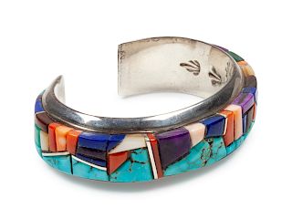 Wes Willie
(Dine, b. 1957)
Sterling silver cuff bracelet with turquoise, lapis, sugilite, coral, and shell mosaic inlay