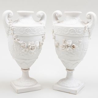Pair of Continental Biscuit Porcelain Urns